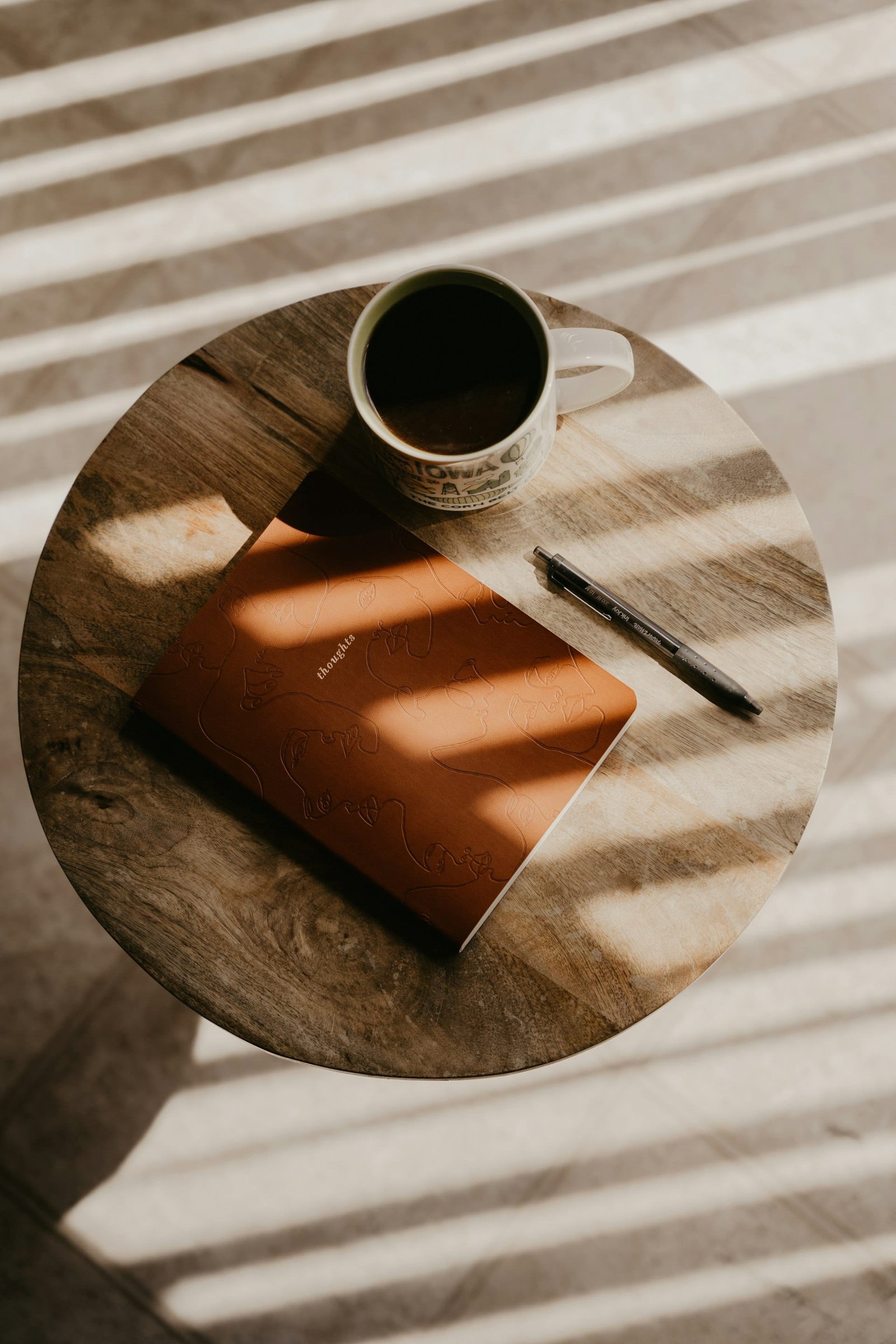 Notebook and coffee on desk